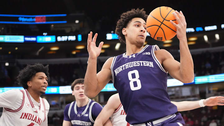 Mar 11, 2026; Chicago, IL, USA; Northwestern Wildcats forward Tre Singleton (8) grabs a rebound against the Indiana Hoosiers during the first half at United Center. 
