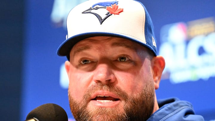 Oct 11, 2025; Toronto, Ontario, CA;  Toronto Blue Jays manager John Schneider (14) speaks to the media during workouts for the American League Championship Series at Rogers Centre.  Mandatory Credit: Dan Hamilton-Imagn Images
