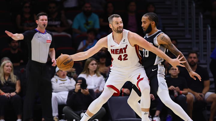 Oct 15, 2024; Miami, Florida, USA; Miami Heat forward Kevin Love (42) protects the ball from San Antonio Spurs forward Julian Champagnie (30) during the second quarter at Kaseya Center. Mandatory Credit: Sam Navarro-Imagn Images Oct 15, 2024; Miami, Florida, USA; Miami Heat forward Kevin Love (42) protects the ball from San Antonio Spurs forward Julian Champagnie (30) during the second quarter at Kaseya Center. Mandatory Credit: Sam Navarro-Imagn Images