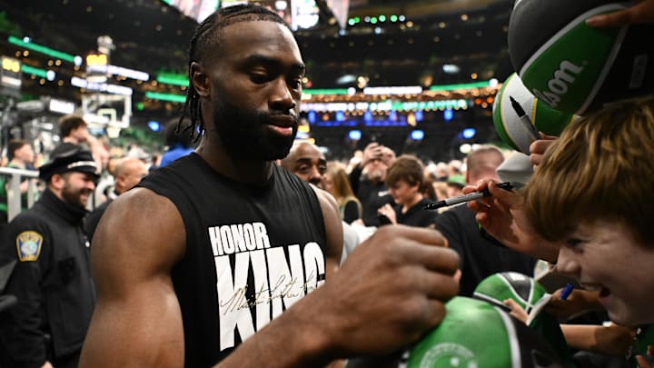 Feb 12, 2025; Boston, Massachusetts, USA; Boston Celtics guard Jaylen Brown (7) signs autographs before a game against the San Antonio Spurs at the TD Garden. Mandatory Credit: Brian Fluharty-Imagn Images