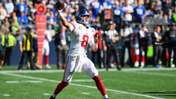 Oct 6, 2024; Seattle, Washington, USA; New York Giants quarterback Daniel Jones (8) passes the ball against the Seattle Seahawks during the first half at Lumen Field. Mandatory Credit: Steven Bisig-Imagn Images