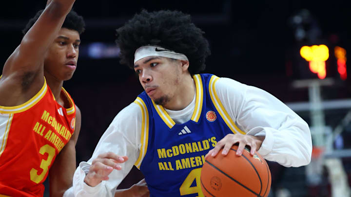 Mar 31, 2026; Glendale, AZ, USA; Tyran Stokes (4) moves the ball against Bruce Branch III (3) during the McDonalds All American Boys Game at Desert Diamond Arena. Mandatory Credit: Mark J. Rebilas-Imagn Images