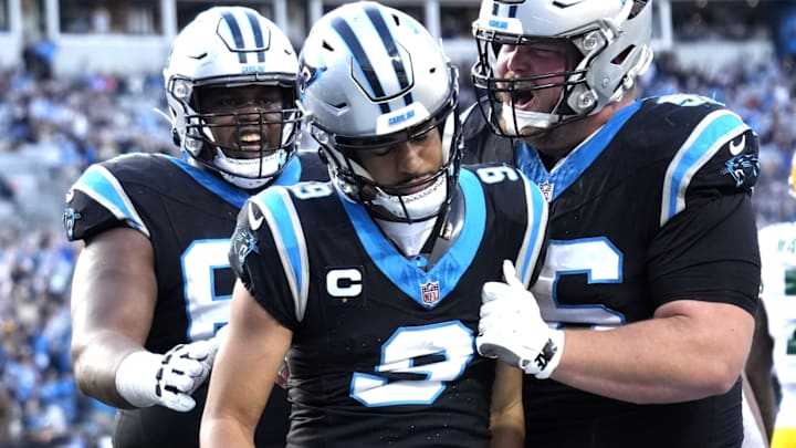 Dec 24, 2023; Charlotte, North Carolina, USA; Carolina Panthers quarterback Bryce Young (9) with guard Gabe Jackson (69) and center Bradley Bozeman (56) in the fourth quarter at Bank of America Stadium. 