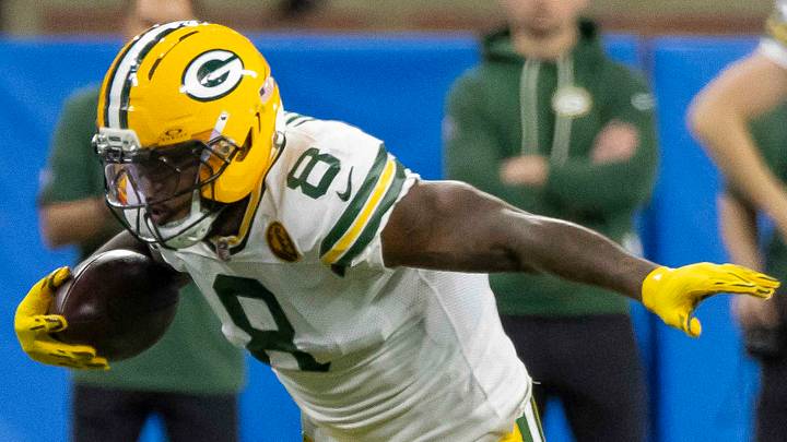 Green Bay Packers running back Josh Jacobs (8) runs the ball against the Detroit Lions at Ford Field. Green Bay Packers running back Josh Jacobs (8) runs the ball against the Detroit Lions at Ford Field.