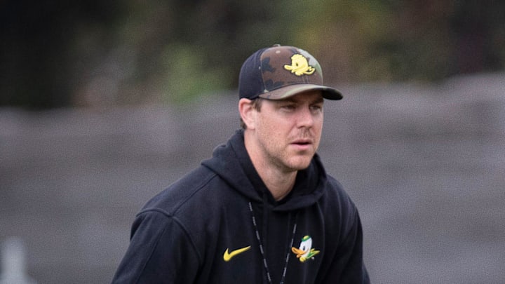 Oregon quarterback Dillon Gabriel throws out a pass as offensive coordinator Will Stein during practice with the Oregon Ducks Tuesday, Aug. 27, 2024 at the Hatfield-Dowlin Complex in Eugene, Ore.