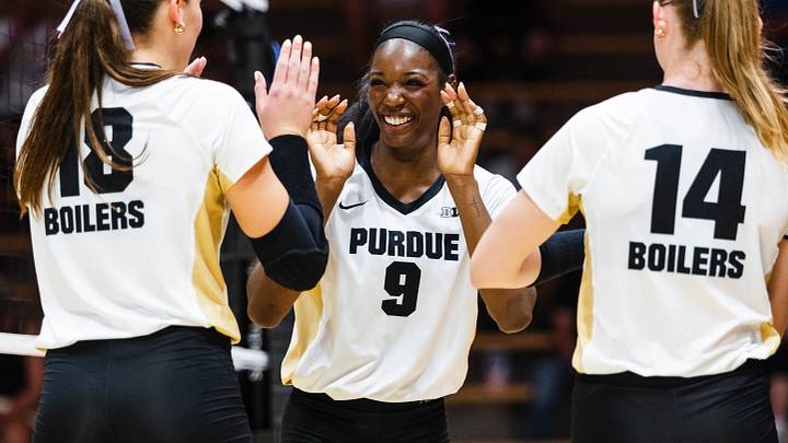 Dior Charles celebrates with teammates during a Purdue match.