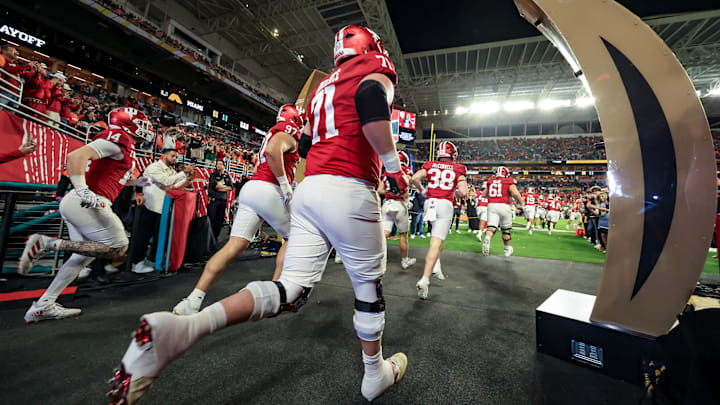 Indiana players run out onto the field at the national championship, enjoying a solid fan advantage in Hard Rock Stadium according to those in Miami.