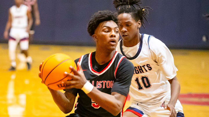 Williston High School guard Deandre Harvey (5) gets pressure from Vanguard's Jandrian Smith (10) as Vanguard takes on Williston during the Kingdom of the Sun basketball tournament at Vanguard High School in Ocala on Thursday, Dec. 28, 2023. Williston won 42-30. Williston High School guard Deandre Harvey (5) gets pressure from Vanguard's Jandrian Smith (10) as Vanguard takes on Williston during the Kingdom of the Sun basketball tournament at Vanguard High School in Ocala on Thursday, Dec. 28, 2023. Williston won 42-30.