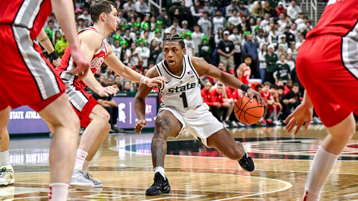 Michigan State's Jeremy Fears Jr., right, moves the ball against Ohio State's Gabe Cupps during the second half on Sunday, Feb. 22, 2026, at the Breslin Center in East Lansing.