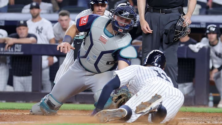 New York Yankees shortstop Anthony Volpe (bottom) scores the game-winning run against the Seattle Mariners on July 10 at Yankee Stadium.
