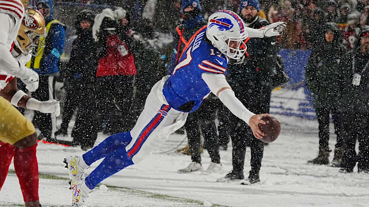Bills Josh Allen leaps to the end zone in a nine-yard touchdown run after getting the ball passed back to him from Amari Cooper during second half action of their home game against the San Francisco 49ers in Orchard Park on Dec. 1, 2024. Bills Josh Allen leaps to the end zone in a nine-yard touchdown run after getting the ball passed back to him from Amari Cooper during second half action of their home game against the San Francisco 49ers in Orchard Park on Dec. 1, 2024.