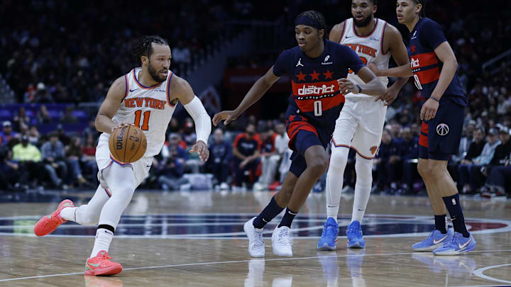 Dec 28, 2024; Washington, District of Columbia, USA; New York Knicks guard Jalen Brunson (11) drives to the basket as Washington Wizards guard Bilal Coulibaly (0) defends in the second quarter at Capital One Arena. Mandatory Credit: Geoff Burke-Imagn Images