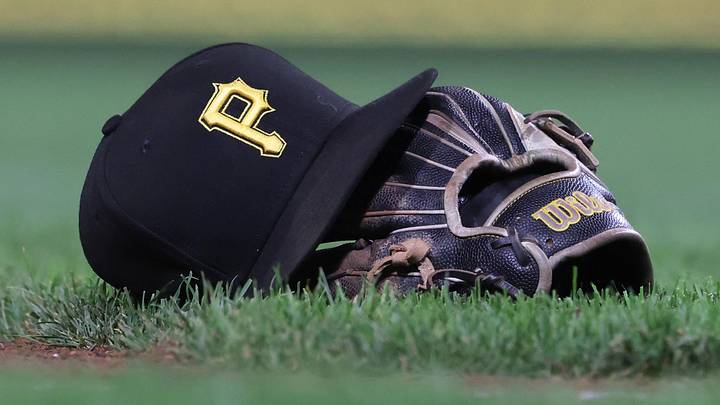 Sep 16, 2025; Pittsburgh, Pennsylvania, USA; A hat and glove belonging to Pittsburgh Pirates third baseman Jared Triolo (not pictured) on the field against the Chicago Cubs during the sixth inning at PNC Park. Mandatory Credit: Charles LeClaire-Imagn Images Sep 16, 2025; Pittsburgh, Pennsylvania, USA; A hat and glove belonging to Pittsburgh Pirates third baseman Jared Triolo (not pictured) on the field against the Chicago Cubs during the sixth inning at PNC Park. Mandatory Credit: Charles LeClaire-Imagn Images