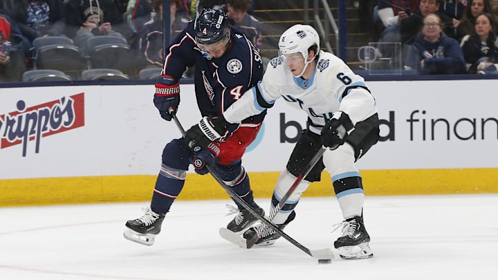 Blue Jackets forward Cole Sillinger works against Mammoth defenseman John Marino.