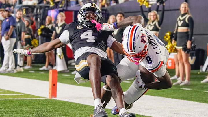 Auburn wide receiver Cam Coleman (8) catches a touchdown pass in front of Vanderbilt cornerback Martel Hight (4) during the fourth quarter at FirstBank Stadium in Nashville, Tenn., Saturday, Nov. 8, 2025.