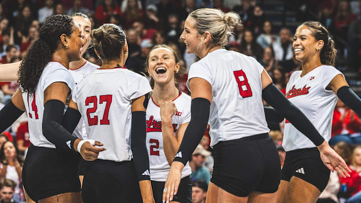 Nebraska setter Bergen Reilly, center, celebrates with her teammates during an exhibition match against Iowa State in her hometown of Sioux Falls. The Huskers won 11 of the 12 sets they played this spring despite rarely using the same lineup from set-to-set. 