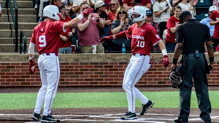 Oklahoma's Camden Johnson celebrates with Brendan Brock