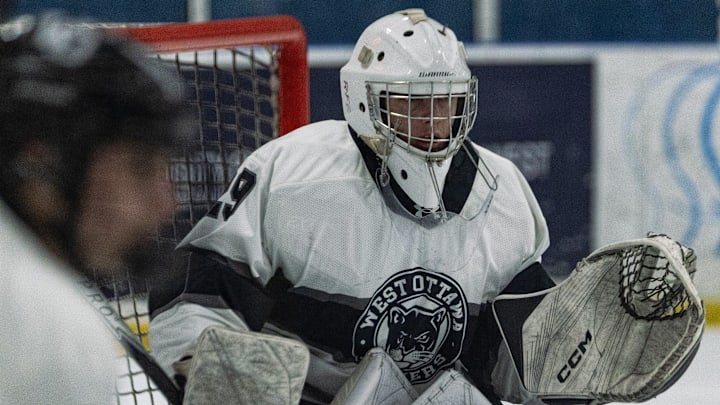 West Ottawa's Preston Turkstra watches the face-off unfold on Wednesday, Jan. 14.
