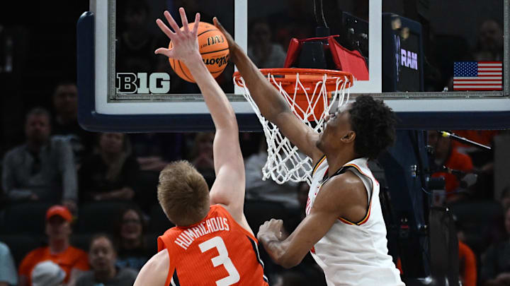 Mar 14, 2025; Indianapolis, IN, USA; Maryland Terrapins forward Tafara Gapare (6) blocks Illinois Fighting Illini forward Ben Humrichous (3) during the first half at Gainbridge Fieldhouse. Mandatory Credit: Robert Goddin-Imagn Images