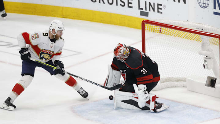 May 28, 2025; Raleigh, North Carolina, USA; Carolina Hurricanes goaltender Frederik Andersen (31) blocks a shot by Florida Panthers forward Sam Bennett (9) during the third period in game five of the Eastern Conference Final of the 2025 Stanley Cup Playoffs at Lenovo Center. Mandatory Credit: Geoff Burke-Imagn Images