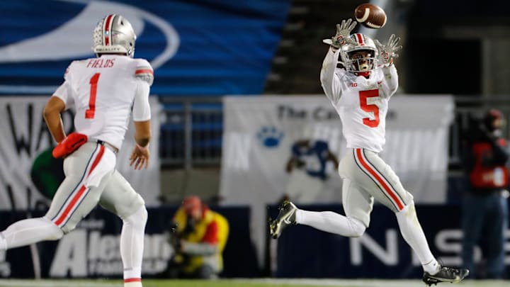Ohio State Buckeyes quarterback Justin Fields (1) throws a pass to wide receiver Garrett Wilson (5) during the NCAA football game at Beaver Stadium in University Park, Pa. on Sunday, Nov. 1, 2020.

Ohio State Faces Penn State In Happy Valley