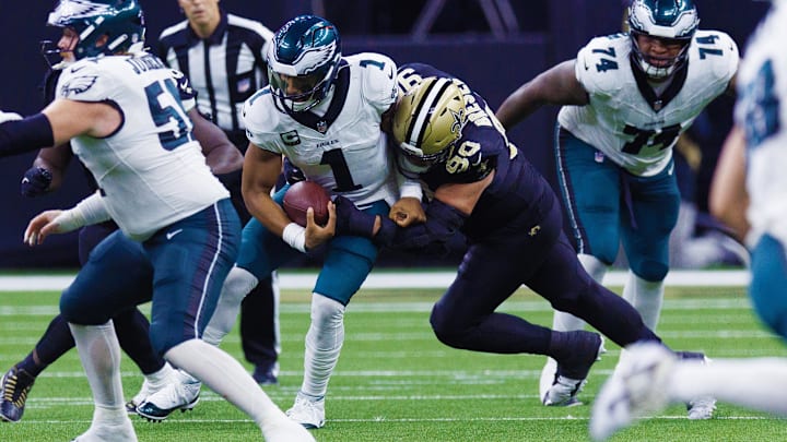 New Orleans Saints defensive tackle Bryan Bresee (90) sacks Philadelphia Eagles quarterback Jalen Hurts (1)