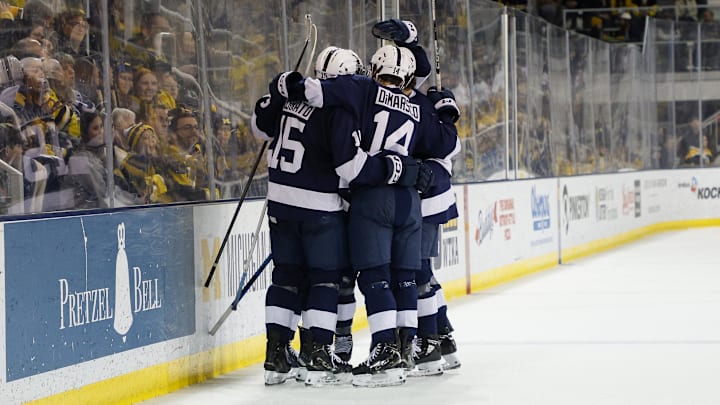 Penn State men's hockey team celebrating a goal.