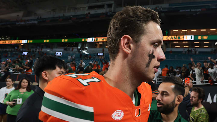 Nov 15, 2025; Miami Gardens, Florida, USA; Miami Hurricanes quarterback Carson Beck (11) walks off the field after the game against NC State Wolfpack at Hard Rock Stadium. Mandatory Credit: Sam Navarro-Imagn Images