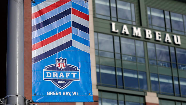 A banner advertising the 2025 NFL Draft hangs outside Lambeau Field.