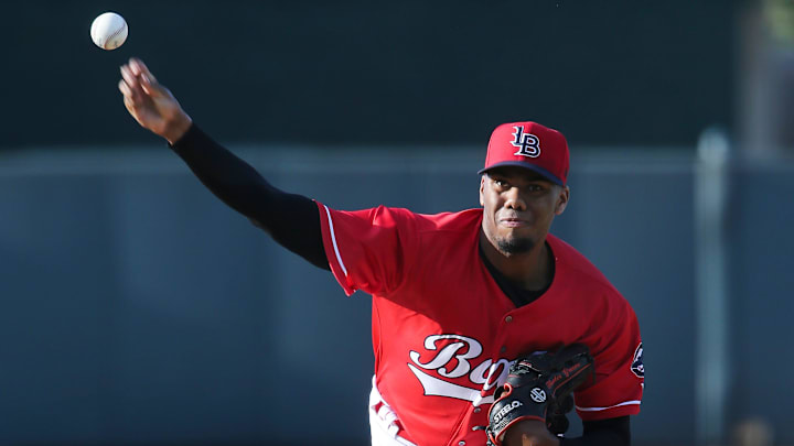 Louisville Bats' Hunter Greene (3) delivers a pitch.