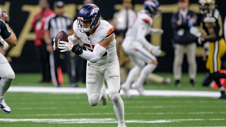 Oct 17, 2024; New Orleans, Louisiana, USA; Denver Broncos linebacker Cody Barton (55) runs back a fumble for a touchdown against New Orleans Saints quarterback Spencer Rattler during the fourth quarter at Caesars Superdome. 
