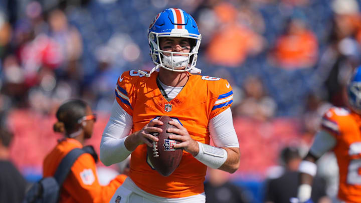 Oct 6, 2024; Denver, Colorado, USA; Denver Broncos quarterback Jarrett Stidham (8) warms up before the game against the Las Vegas Raiders at Empower Field at Mile High. Mandatory Credit: Ron Chenoy-Imagn Images