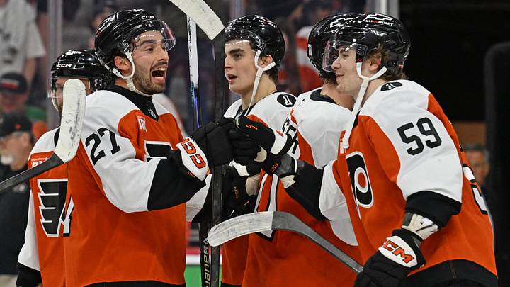 Apr 14, 2026; Philadelphia, Pennsylvania, USA; Philadelphia Flyers left wing Noah Cates (27) and defenseman Oliver Bonk (59) celebrate win against the MontrŽal Canadiens at Xfinity Mobile Arena. Mandatory Credit: Eric Hartline-Imagn Images