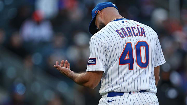 Apr 7, 2026; New York City, New York, USA; New York Mets pitcher Luis Garcia (40) reacts after being hit by a ground ball during the seventh inning against the Arizona Diamondbacks  at Citi Field. Mandatory Credit: Vincent Carchietta-Imagn Images