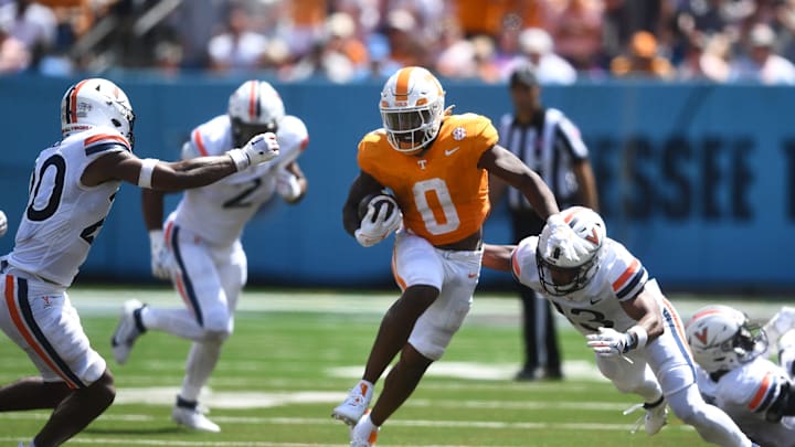 Tennessee Volunteers running back Jaylen Wright (0) runs through Virginia Cavaliers cornerback Sam