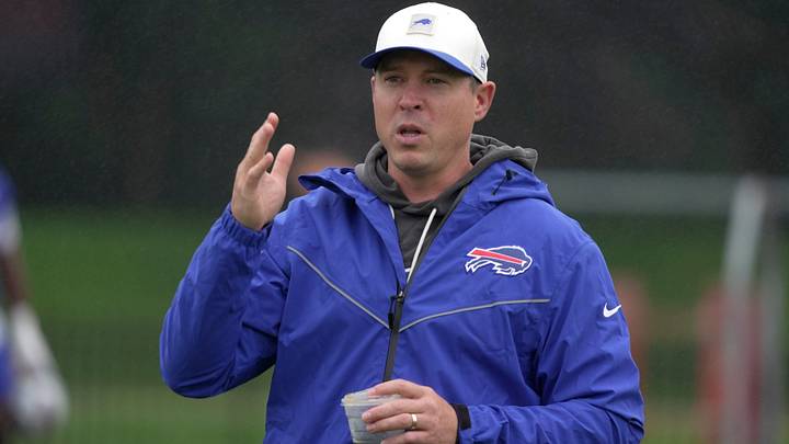 Bills defense coordinator Jim Leonhard talks to someone on the sidelines before practice at Bills Training Camp at St. John Fisher University in Pittsford on Aug. 13 2026. Bills defense coordinator Jim Leonhard talks to someone on the sidelines before practice at Bills Training Camp at St. John Fisher University in Pittsford on Aug. 13 2026.