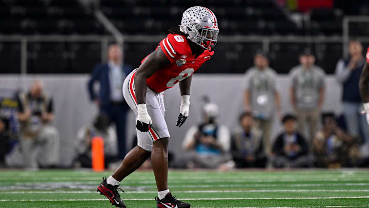 Dec 31, 2025; Arlington, TX, USA; Ohio State Buckeyes linebacker Arvell Reese (8) gets into position during the 2025 Cotton Bowl and quarterfinal game of the College Football Playoff at AT&T Stadium. Mandatory Credit: Jerome Miron-Imagn Images Dec 31, 2025; Arlington, TX, USA; Ohio State Buckeyes linebacker Arvell Reese (8) gets into position during the 2025 Cotton Bowl and quarterfinal game of the College Football Playoff at AT&T Stadium. Mandatory Credit: Jerome Miron-Imagn Images