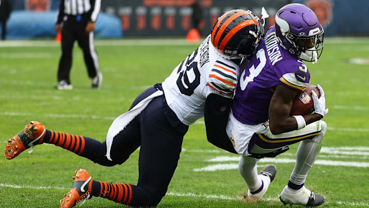 Vikings receiver Jordan Addison is dragged down by Bears cornerback Tyrique Stevenson during November's game in Chicago.