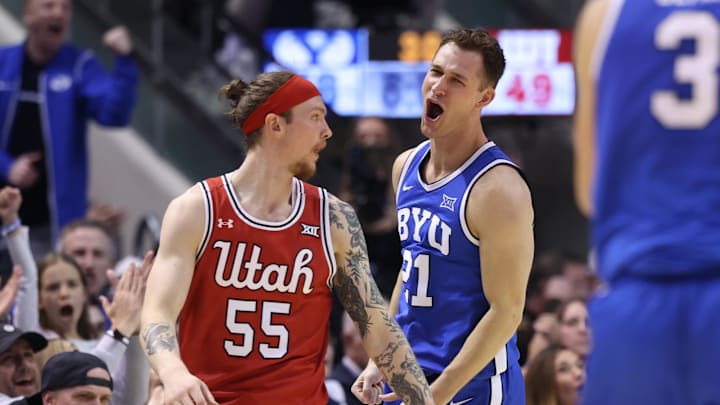 Mar 8, 2025; Provo, Utah, USA; Utah Utes forward Ayomide Bamisile (21) reacts to making a shot against Utah Utes guard Gabe Madsen (55) during the second half at Marriott Center. Mandatory Credit: Rob Gray-Imagn Images Mar 8, 2025; Provo, Utah, USA; Utah Utes forward Ayomide Bamisile (21) reacts to making a shot against Utah Utes guard Gabe Madsen (55) during the second half at Marriott Center. Mandatory Credit: Rob Gray-Imagn Images