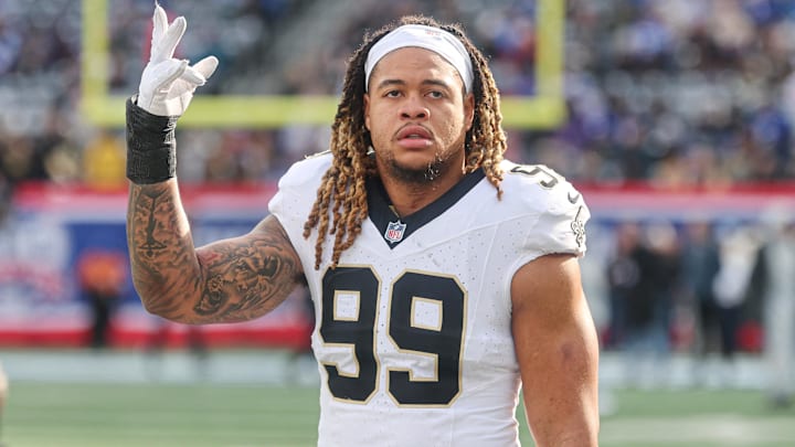 Dec 8, 2024; East Rutherford, New Jersey, USA; New Orleans Saints defensive end Chase Young (99) looks up at fans before the game against the New York Giants at MetLife Stadium. Mandatory Credit: Vincent Carchietta-Imagn Images