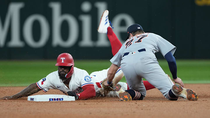 Jul 19, 2025; Arlington, Texas, USA; Texas Rangers right fielder Adolis Garcia (53) safely steals second base ahead of the tag by Detroit Tigers shortstop Trey Sweeney (27) during the second inning at Globe Life Field. Mandatory Credit: Jim Cowsert-Imagn Images Jul 19, 2025; Arlington, Texas, USA; Texas Rangers right fielder Adolis Garcia (53) safely steals second base ahead of the tag by Detroit Tigers shortstop Trey Sweeney (27) during the second inning at Globe Life Field. Mandatory Credit: Jim Cowsert-Imagn Images