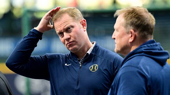 Oct 2, 2024; Milwaukee, Wisconsin, USA; Milwaukee Brewers general manager Matt Arnold talks to manager Matt Arnold before game two of the Wildcard round for the 2024 MLB Playoffs against the New York Mets at American Family Field. Mandatory Credit: Benny Sieu-Imagn Images Oct 2, 2024; Milwaukee, Wisconsin, USA; Milwaukee Brewers general manager Matt Arnold talks to manager Matt Arnold before game two of the Wildcard round for the 2024 MLB Playoffs against the New York Mets at American Family Field. Mandatory Credit: Benny Sieu-Imagn Images