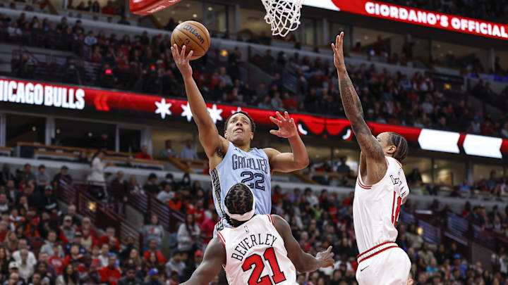 Apr 2, 2023; Chicago, Illinois, USA; Memphis Grizzlies guard Desmond Bane (22) goes to the basket against Chicago Bulls guard Patrick Beverley (21) during the first half at United Center. Mandatory Credit: Kamil Krzaczynski-Imagn Images