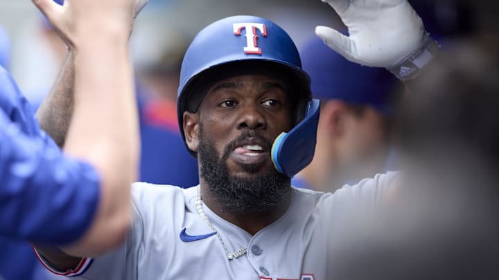 Aug 3, 2025; Seattle, Washington, USA; Texas Rangers right fielder Adolis García (53) is congratulated in the dugout after hitting a solo home run off Seattle Mariners pitcher Carlos Vargas (not pictured) during the sixth inning at T-Mobile Park. Aug 3, 2025; Seattle, Washington, USA; Texas Rangers right fielder Adolis García (53) is congratulated in the dugout after hitting a solo home run off Seattle Mariners pitcher Carlos Vargas (not pictured) during the sixth inning at T-Mobile Park.