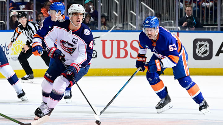 Blue Jackets center Cole Sillinger looks to make a play with the puck against the New York Islanders.