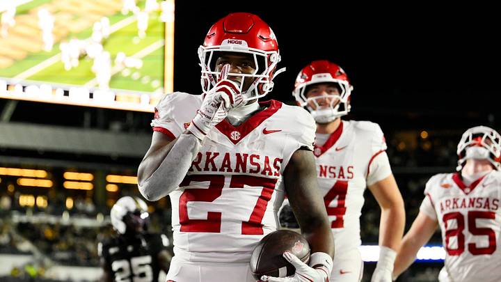 Arkansas Razorbacks running back Cam Settles (27) celebrates his touchdown against the Vanderbilt Commodores during the second half at FirstBank Stadium. Arkansas Razorbacks running back Cam Settles (27) celebrates his touchdown against the Vanderbilt Commodores during the second half at FirstBank Stadium.