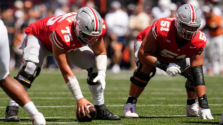 Ohio State Buckeyes offensive lineman Carson Hinzman (75) prepares to snap the ball beside offensive lineman Luke Montgomery (51) during the NCAA football game against the Texas Longhorns at Ohio Stadium on Aug. 30, 2025. Ohio State Buckeyes offensive lineman Carson Hinzman (75) prepares to snap the ball beside offensive lineman Luke Montgomery (51) during the NCAA football game against the Texas Longhorns at Ohio Stadium on Aug. 30, 2025.
