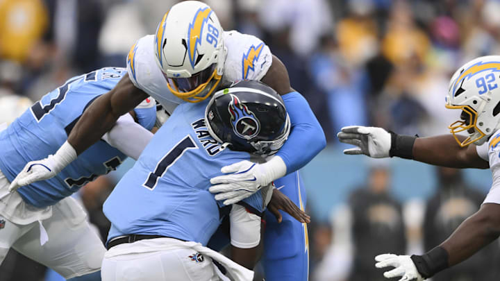 Los Angeles Chargers linebacker Odafe Oweh (98) sacks Tennessee Titans quarterback Cam Ward (1)