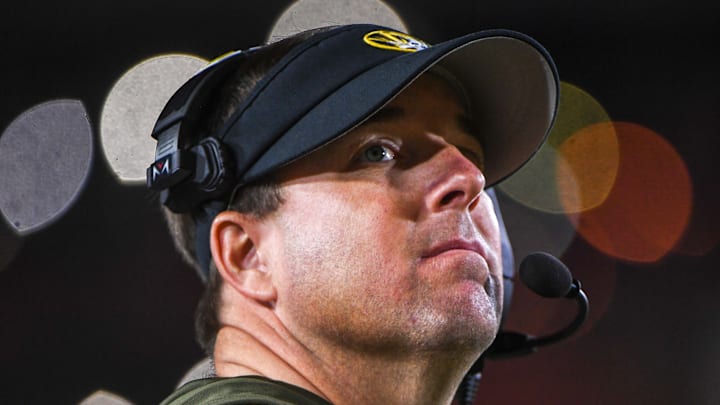 Nov 15, 2025; Columbia, Missouri, USA; Missouri Tigers head coach Eli Drinkwitz looks at the scoreboard in the Missouri matchup against Mississippi State at Faurot Field.