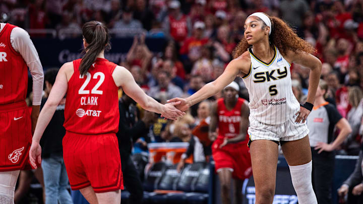 May 17, 2025; Indianapolis, Indiana, USA; Indiana Fever guard Caitlin Clark (22) and Chicago Sky forward Angel Reese (5) shake hands before the game at Gainbridge Fieldhouse. Mandatory Credit: Trevor Ruszkowski-Imagn Images